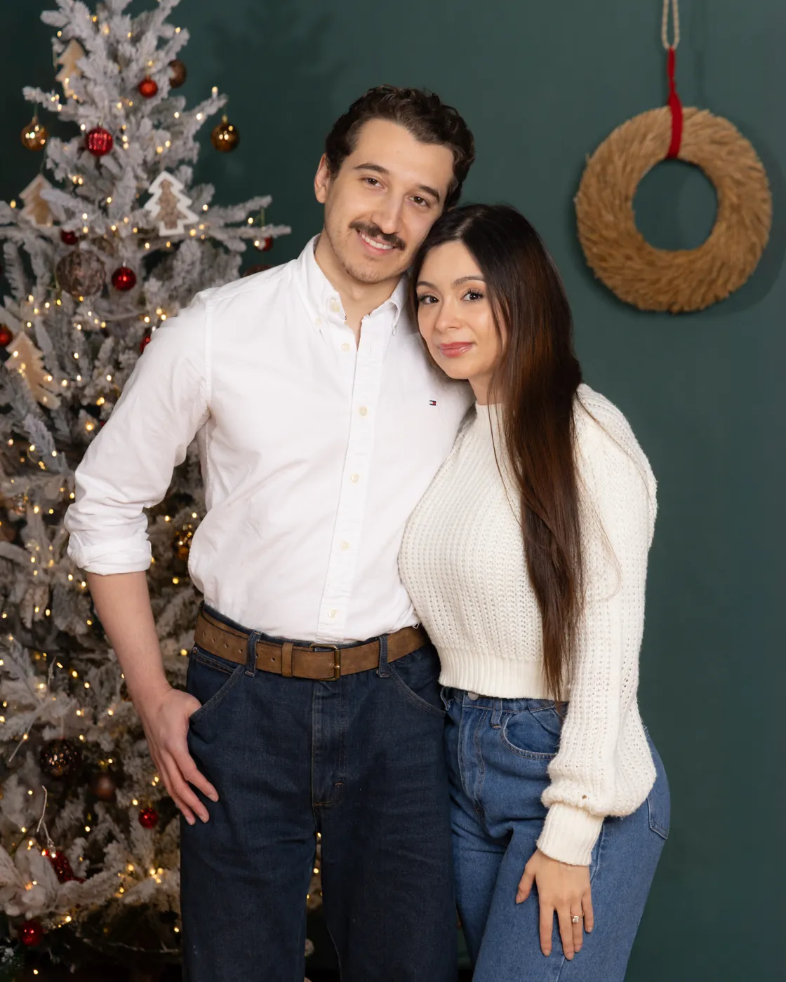 Couple by the Christmas tree, holiday mini session
